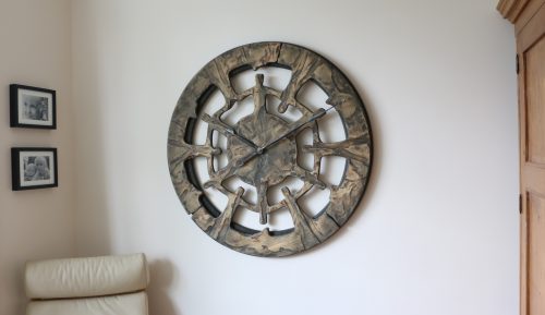 unique wall clock displayed in the Living Room